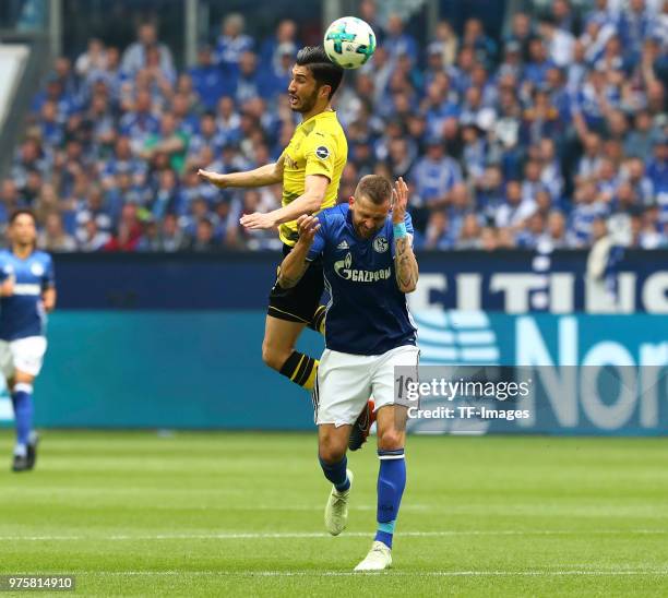 Nuri Sahin of Dortmund and Guido Burgstaller of Schalke battle for the ball during the Bundesliga match between FC Schalke 04 and Borussia Dortmund...