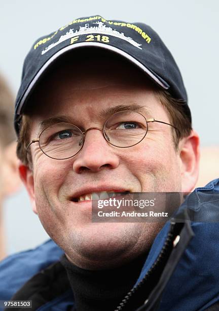 German Defense Minister Karl-Theodor zu Guttenberg looks on during his inaugural visit aboard the FGS Mecklenburg Vorpommern Navy frigate on March 9,...