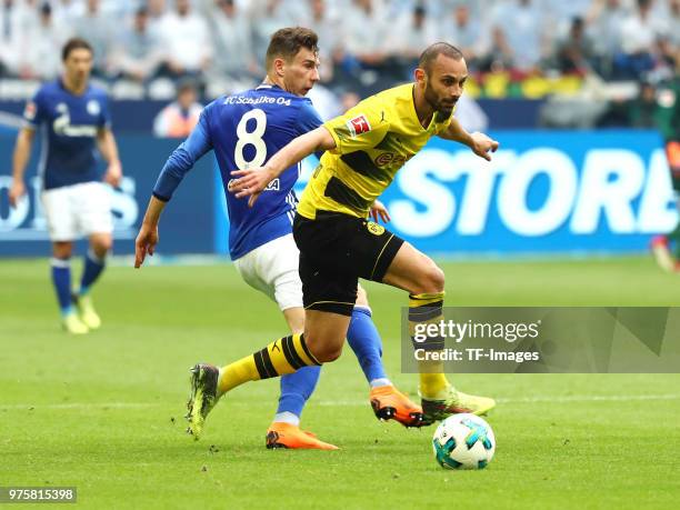 Leon Goretzka of Schalke and Oemer Toprak of Dortmund battle for the ball during the Bundesliga match between FC Schalke 04 and Borussia Dortmund at...