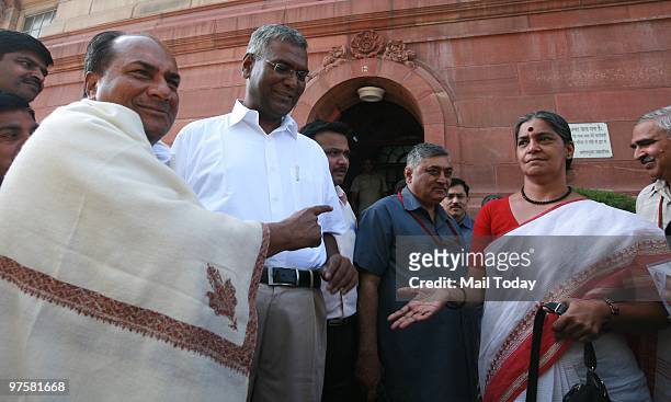 Defence minister AK Antony, left party leader D Raja and his wife Eni Raja talks to the media as they press for the passage of Women's Reservation...