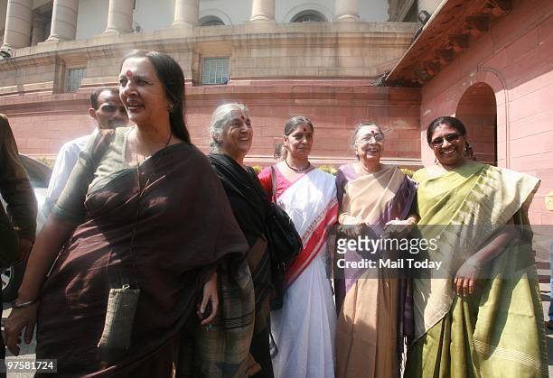 Leader Brinda Karat with representatives of various Women's Organisations raise slogans as they press for the passage of Women's Reservation Bill...