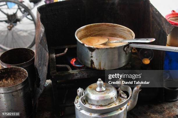 street tea stall - making tea stock pictures, royalty-free photos & images