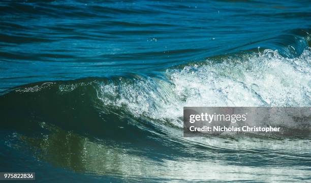 make waves - nicholas christopher stock pictures, royalty-free photos & images