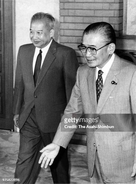 Prince Norodom Sihanouk Of Cambodia is escorted by Japanese Prime Minister Noboru Takeshita prior to their meeting at the prime minister's official...