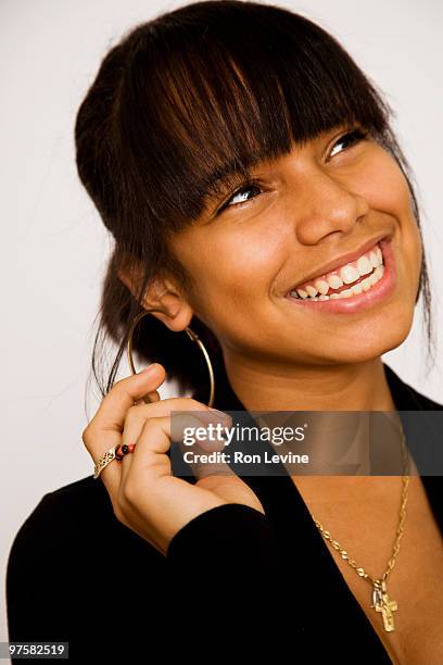 teen girl touching her hoop earring, portrait - hoop earring bildbanksfoton och bilder