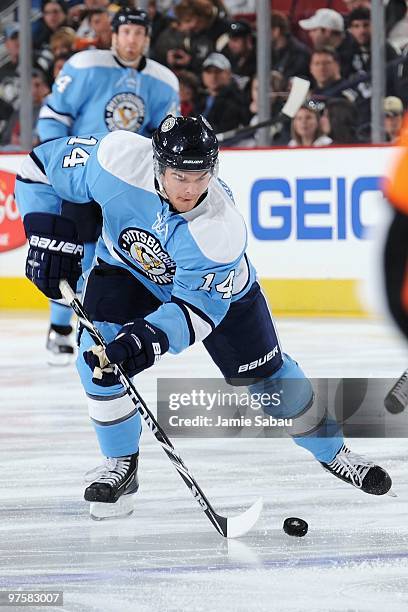 Forward Chris Kunitz of the Pittsburgh Penguins skates with the puck against the Dallas Stars on March 6, 2010 at Mellon Arena in Pittsburgh,...