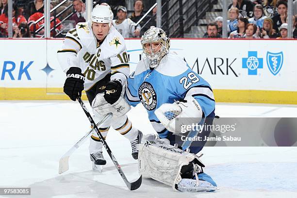 Goaltender Marc-Andre Fleury of the Pittsburgh Penguins defends against forward Brenden Morrow of the Dallas Stars on March 6, 2010 at Mellon Arena...