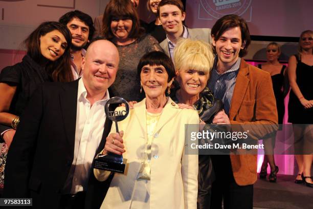 Actress June Brown poses with her award and fellow Eastenders cast members at the 2010 TRIC Awards at the Grovesnor House Hotel March 09, 2010 in...