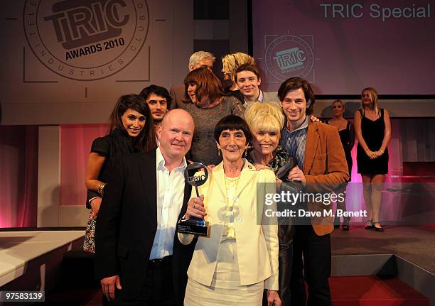 Actress June Brown poses with her award and fellow Eastenders cast members at the 2010 TRIC Awards at the Grovesnor House Hotel March 09, 2010 in...