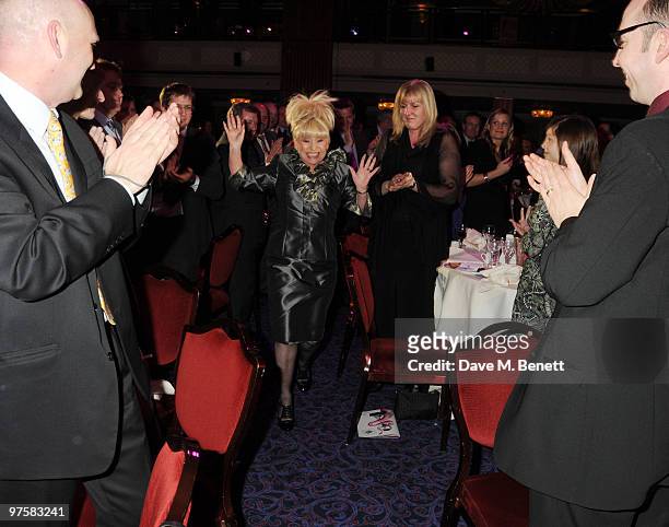 Actress Barbara Windsor is applauded as she goes up to accept her award at the 2010 TRIC Awards at the Grovesnor House Hotel March 09, 2010 in...