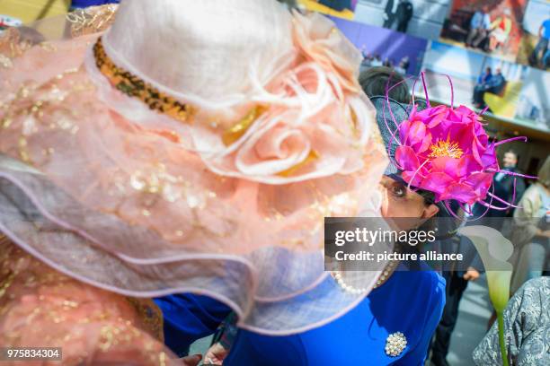 Dpatop - 19 May 2018, Germany, Berlin: Guests with spectacular hats attend a celebration and live broadcast of the royal wedding of Prince Harry and...