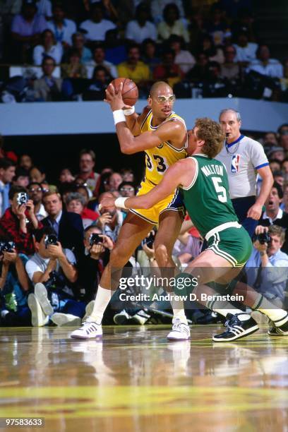 Kareem Abdul-Jabbar of the Los Angeles Lakers posts up against Bill Walton of the Boston Celtics during a game played in 1987 at the Great Western...