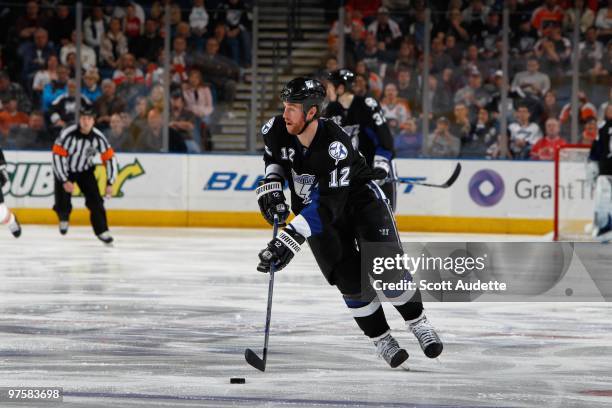 Ryan Malone of the Tampa Bay Lightning controls the puck against the Philadelphia Flyers at the St. Pete Times Forum on March 2, 2010 in Tampa,...