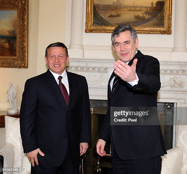 King Abdullah II of Jordan and British Prime Minister Gordon Brown pose for a photograph ahead of talks at Downing Street on March 09, 2010 in...