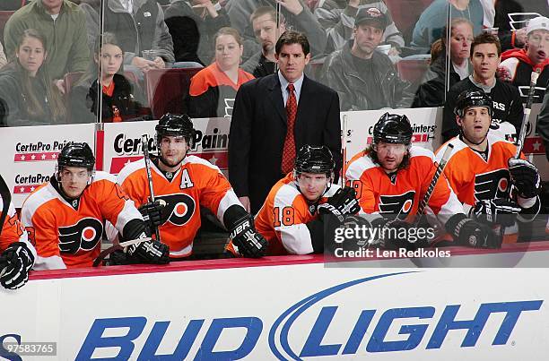Danny Briere, Simon Gagne, Head Coach Peter Laviolette, Mike Richards, Scott Hartnell, Ian Laperriere and Head Equipment Manager Derek Settlemyre of...