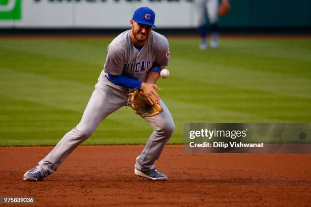 Kris Bryant of the Chicago Cubs misplays a ground ball against the St. Louis Cardinals in the second inning at Busch Stadium on June 15, 2018 in St....