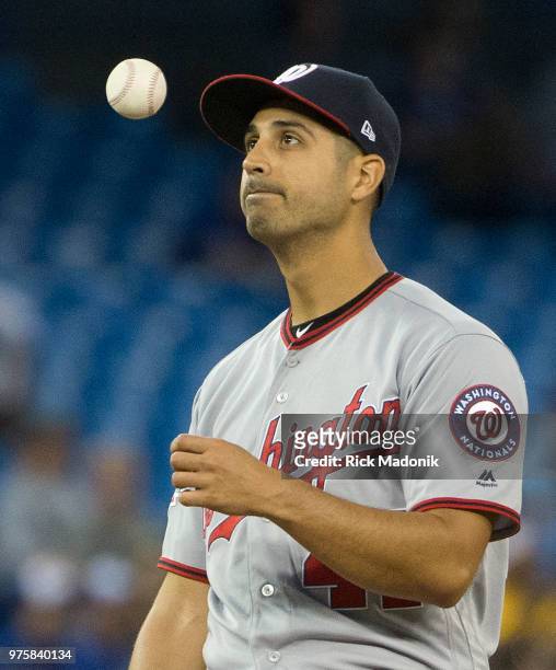 Washington Nationals starting pitcher Gio Gonzalez tosses the ball to himself as he tries to understand what just happened. He wouldn't get to face...