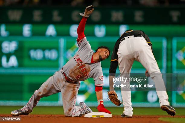 Billy Hamilton of the Cincinnati Reds calls time after stealing second base in the ninth inning against Jordy Mercer of the Pittsburgh Pirates at PNC...