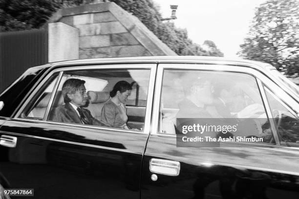 Crown Prince Akihito and Crown Princess Michiko are seen on departure at the Akasaka Palace to see Emperor Hirohito after vomiting blood on September...