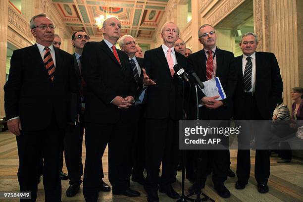 Ulster Unionist Party Leader Sir Reg Empey speaks to the media with is party members at Stormont Parliament buildings in Belfast, Northern Ireland...