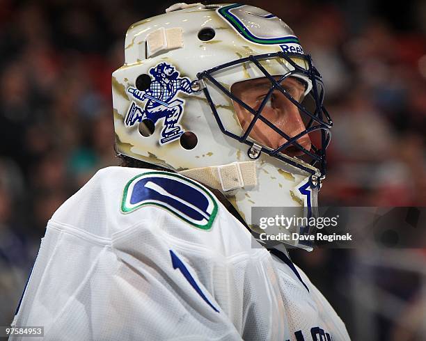 Roberto Luongo of the Vancouver Canucks looks down the ice during an NHL game against the Detroit Red Wings at Joe Louis Arena on March 3, 2010 in...