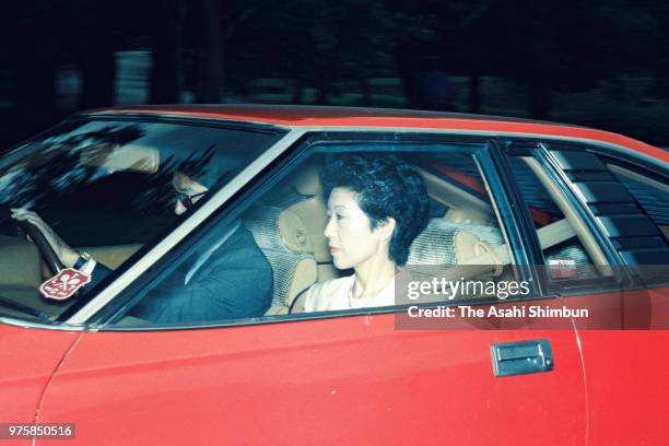 Takako Shimazu, daughter of Emperor Hirohito, and her husband Hisanaga are seen on arrival at the Imperial Palace to see the Emperor after vomiting...