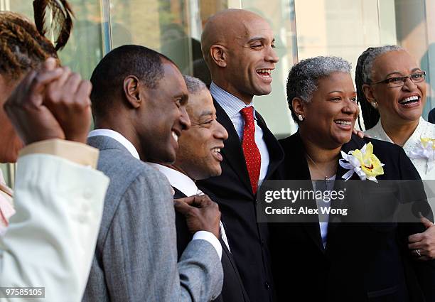 Mayor Adrian Fenty poses for photos with newly wed couples, Rocky Galloway, Reggie Stanley, Candy Holmes and Darlene Garner after their weddings on...