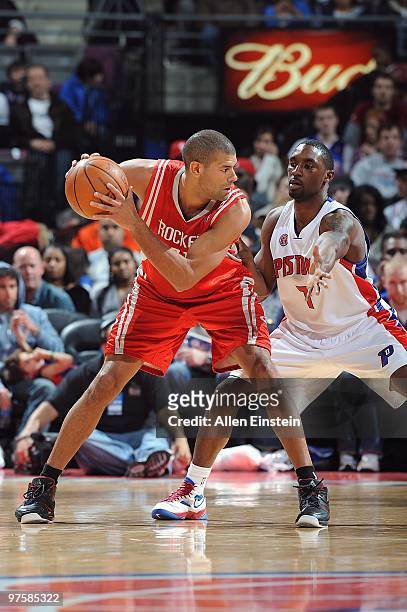 Shane Battier of the Houston Rockets handles the ball against Ben Gordon of the Detroit Pistons during the game on March 7, 2010 at The Palace of...