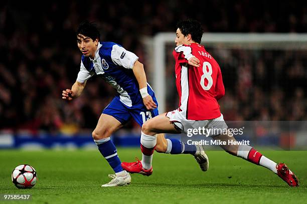 Fucile of Porto goes past the challenge from Samir Nasri of Arsenal during the UEFA Champions League round of 16 match between Arsenal and FC Porto...