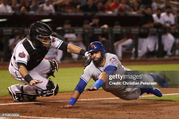 Jose Bautista of the New York Mets is tagged out by catcher Alex Avila of the Arizona Diamondbacks attempting to score a run during the second inning...