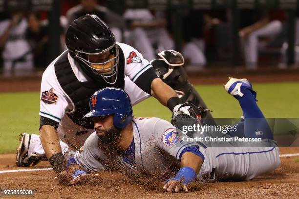 Jose Bautista of the New York Mets is tagged out by catcher Alex Avila of the Arizona Diamondbacks attempting to score a run during the second inning...