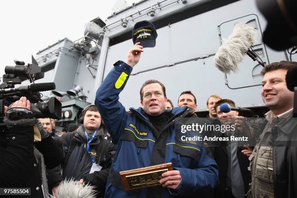 German Defense Minister Karl-Theodor zu Guttenberg speaks to sailors of the German navy during his inaugural visit aboard the FGS Mecklenburg...