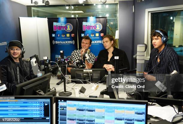 Michael Clifford, Ashton Irwin, Luke Hemmings and Calum Hood of 5 Seconds of Summer visit SiriusXM's Morning Mash Up SiriusXM Studios on June 15,...