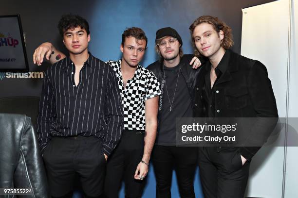 Calum Hood, Ashton Irwin, Michael Clifford and Luke Hemmings of 5 Seconds of Summer visit SiriusXM's Morning Mash Up SiriusXM Studios on June 15,...