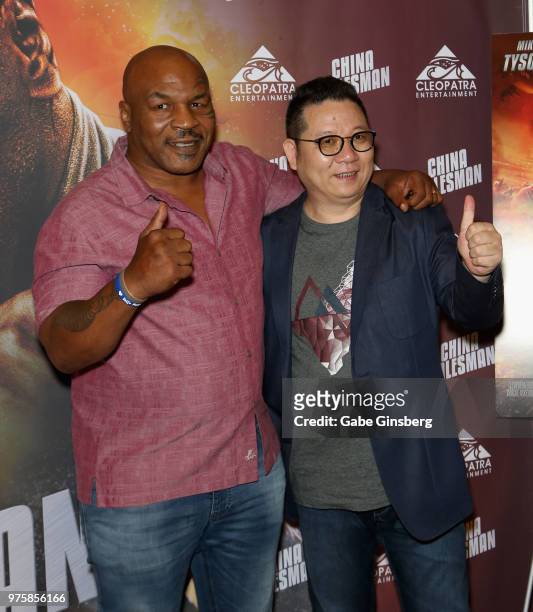 Actor and former boxer Mike Tyson and director Tan Bing attend the world premiere of the movie "China Salesman" at the Cannery Casino Hotel on June...