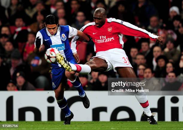 Falcao of Porto is tackled by Sol Campbell of Arsenal during the UEFA Champions League round of 16 match between Arsenal and FC Porto at the Emirates...