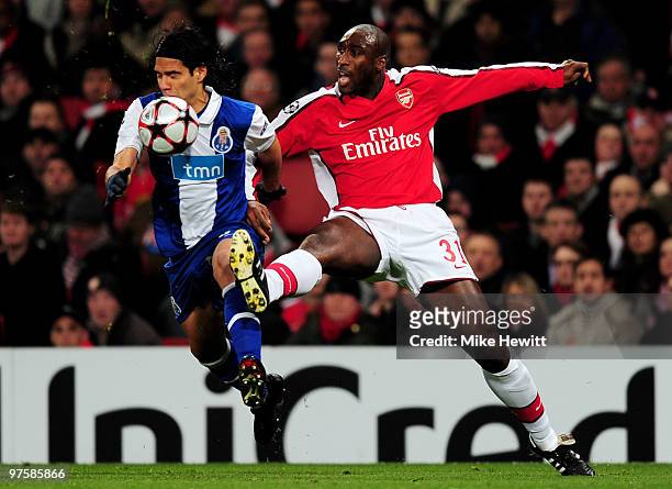 Falcao of Porto is tackled by Sol Campbell of Arsenal during the UEFA Champions League round of 16 match between Arsenal and FC Porto at the Emirates...