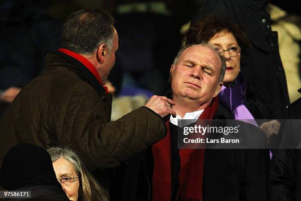 President Uli Hoeness of Muenchen looks on next to Karl Heinz Rummenigge prior to the UEFA Champions League round of sixteen, second leg match...