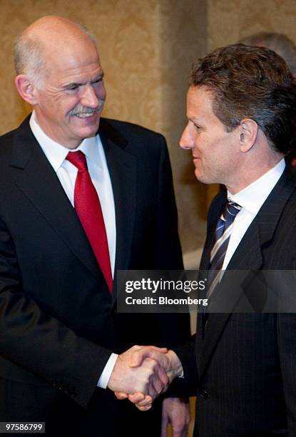 George Papandreou, prime minister of Greece, left, shakes hands with Timothy Geithner, U.S. Treasury secretary, in Washington, D.C., U.S., on...