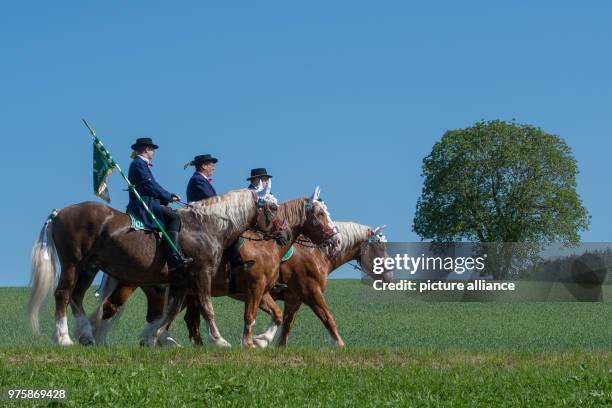 May 2018, Germany, Bad Koetzing: Participants of the Whit Monday procession ride their horses. This event, counting with almost 900 participants,...