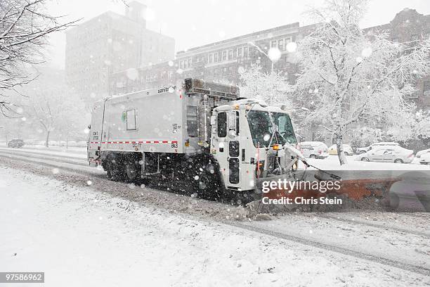 snow plow in a snow storm - snowplow stockfoto's en -beelden