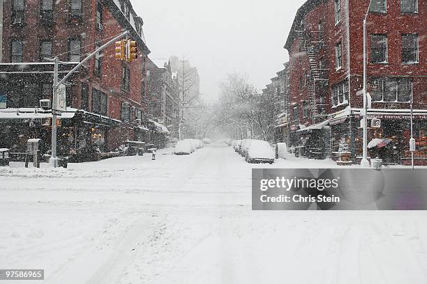 snow covered intersection - blizzard stock-fotos und bilder