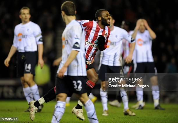 Darren Bent of Sunderland celebrates scoring his hat-trick to make it 4-0 amoung dejected Bolton players, during the Barclays Premier League match...