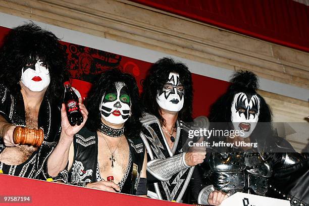 Paul Stanley, Eric Singer, Tommy Thayer and Gene Simmons of the band Kiss ring the closing bell at the New York Stock Exchange on January 25, 2010 in...