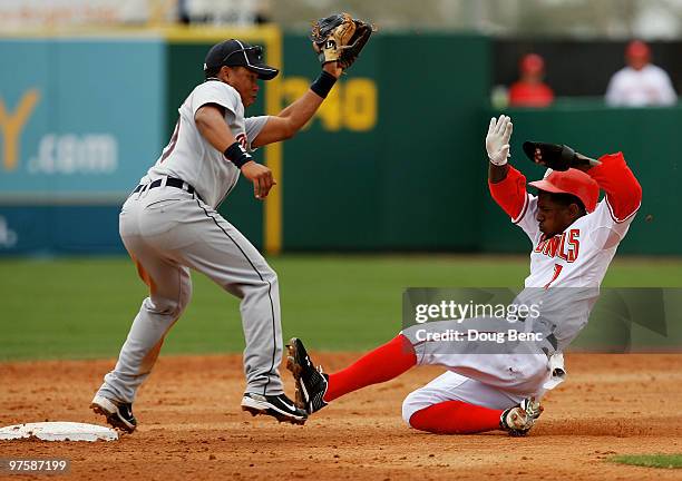 Outfielder Nyjer Morgan of the Washington Nationals steals second base ahead of the tag from shortstop Ramon Santiago of the Detroit Tigers at Space...
