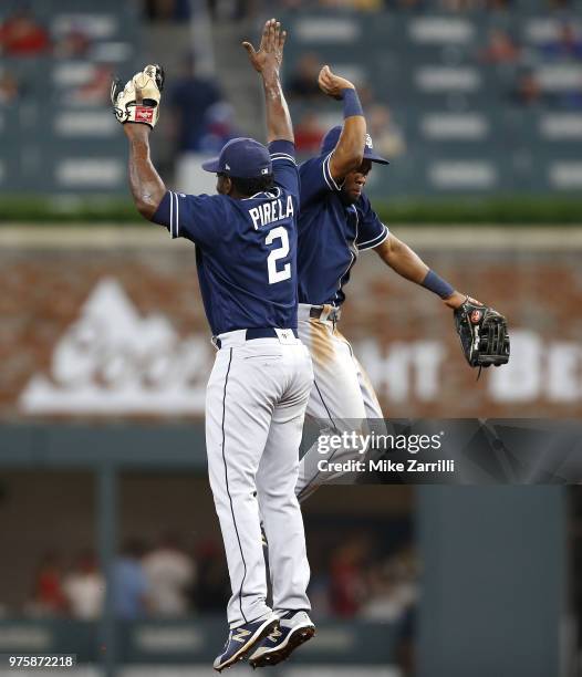 Second baseman Jose Pirela and centerfielder Manuel Margot of the San Diego Padres high five after the game against the Atlanta Braves at SunTrust...