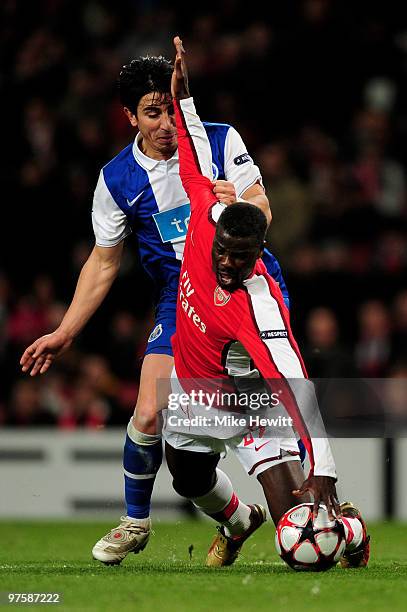 Emmanuel Eboue of Arsenal wins a penalty as he is brought down by Fucile of Porto during the UEFA Champions League round of 16 match between Arsenal...