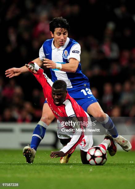 Emmanuel Eboue of Arsenal is wins a penalty as he is brought down by Fucile of Porto during the UEFA Champions League round of 16 match between...