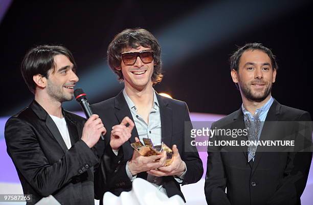 French members of pop rock music band "Pony Pony Run Run" Gaetan , Amael and Antonin give a speech after receiving the award for popular revelation...