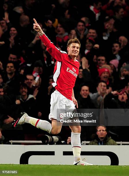 Nicklas Bendtner of Arsenal celebrates after scoring his team's second goal during the UEFA Champions League round of 16 match between Arsenal and FC...